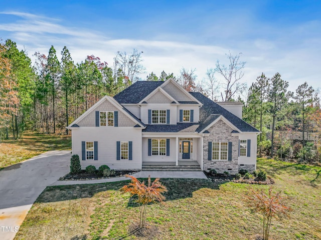 craftsman-style house with covered porch and a front lawn