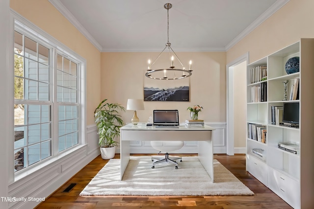 office space featuring a chandelier, ornamental molding, and dark wood-type flooring