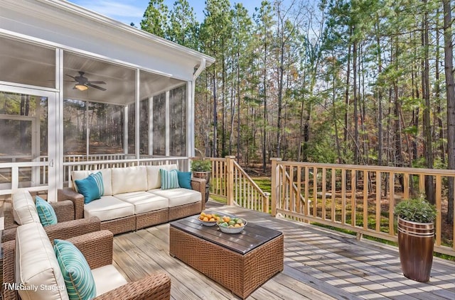 deck featuring an outdoor hangout area and a sunroom