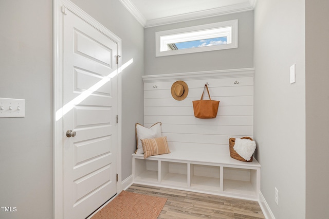 mudroom with light hardwood / wood-style floors and ornamental molding