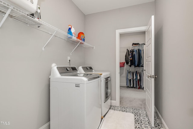 clothes washing area featuring washing machine and clothes dryer