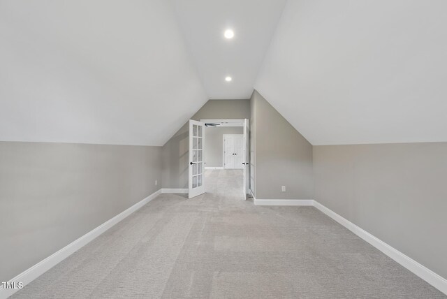 2637 Trifle Ln, Wake Forest, NC 27587 - additional living space featuring vaulted ceiling, recessed lighting, baseboards, light colored carpet, and french doors