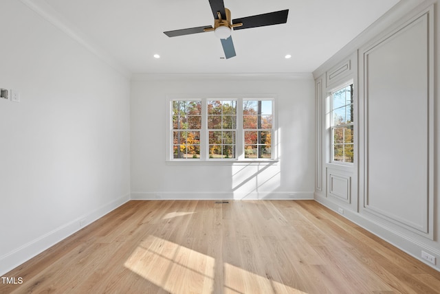 unfurnished room with ceiling fan, crown molding, and light hardwood / wood-style floors