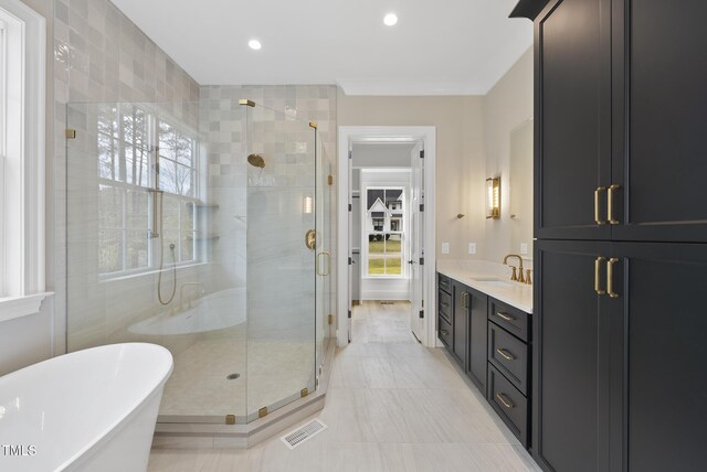 2637 Trifle Ln, Wake Forest, NC 27587 - bathroom with a shower stall, a freestanding bath, vanity, recessed lighting, and tile patterned flooring
