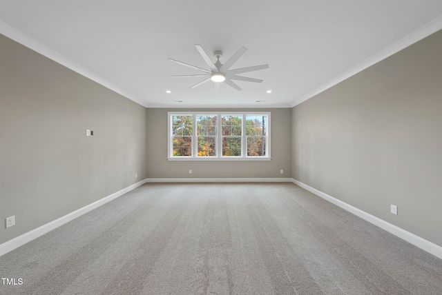 unfurnished room featuring crown molding, ceiling fan, and light carpet