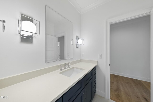 2637 Trifle Ln, Wake Forest, NC 27587 - bathroom with vanity, baseboards, crown molding, and wood finished floors