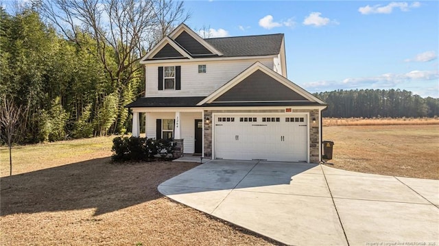 craftsman-style home with covered porch and a garage