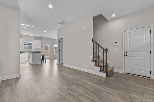 unfurnished living room featuring hardwood / wood-style floors