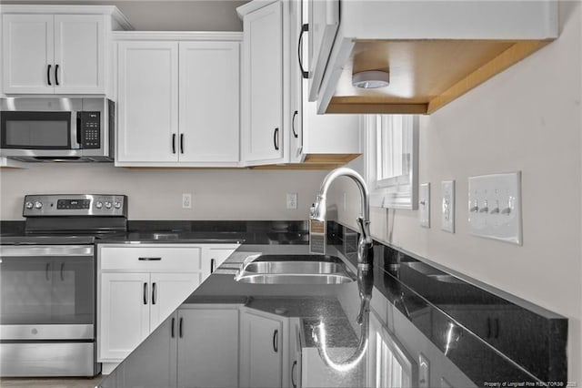 kitchen featuring white cabinets, sink, and stainless steel appliances