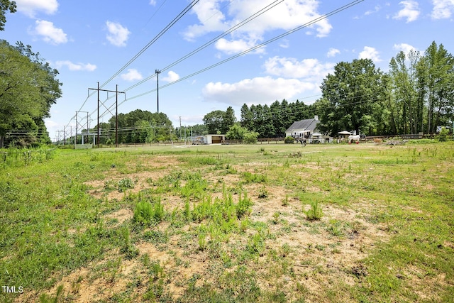 view of yard with a rural view