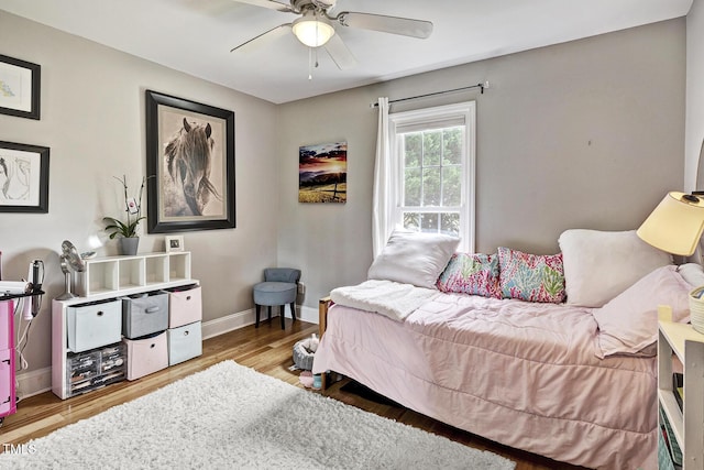 bedroom with ceiling fan and wood-type flooring