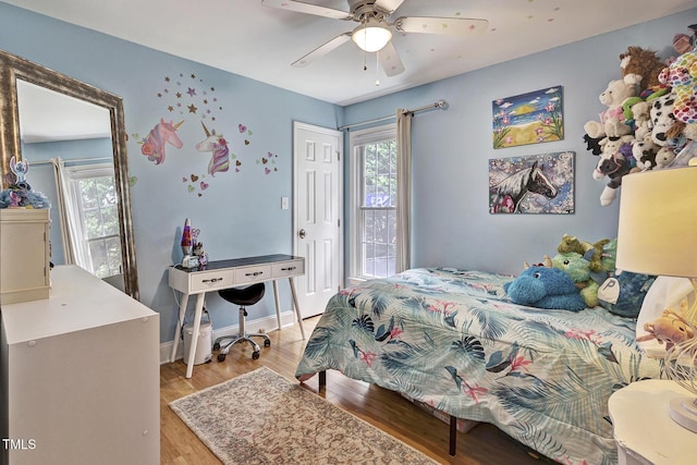 bedroom featuring light hardwood / wood-style flooring and ceiling fan