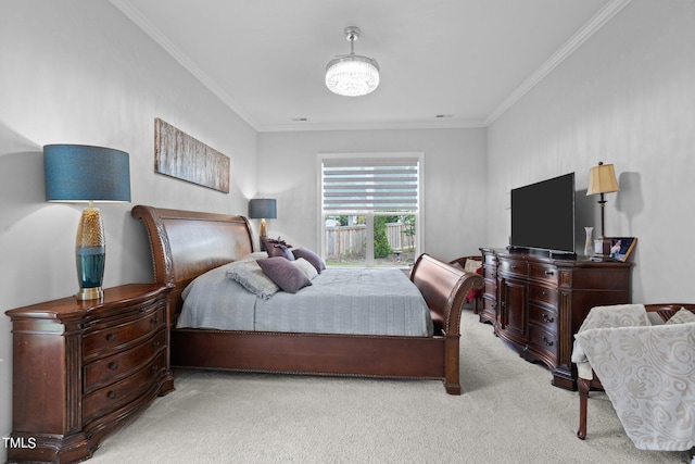 bedroom with ornamental molding and light carpet