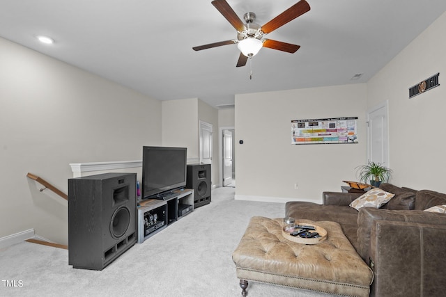 living room with carpet floors, ceiling fan, and baseboards