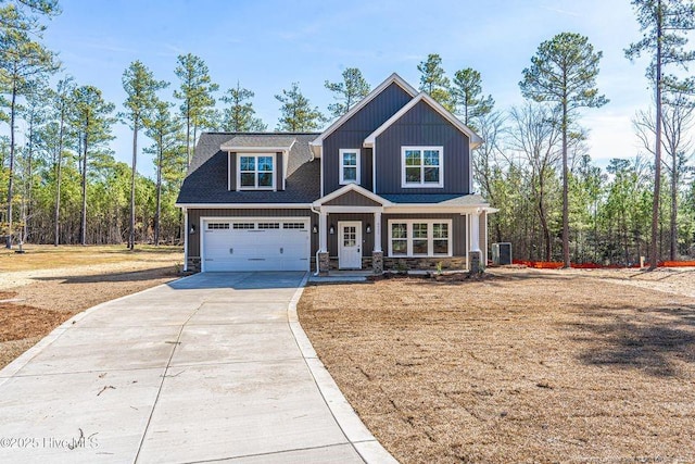 craftsman-style house with driveway and a shingled roof