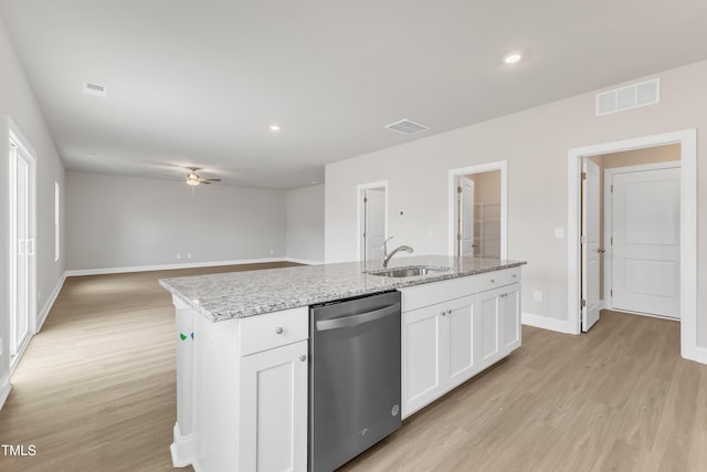 kitchen featuring sink, a center island with sink, dishwasher, light hardwood / wood-style floors, and white cabinets