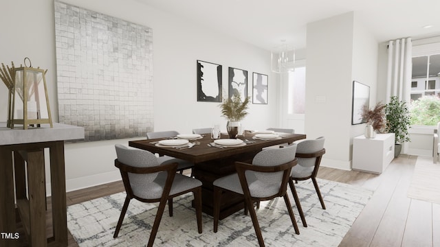 dining area featuring a notable chandelier and light wood-type flooring