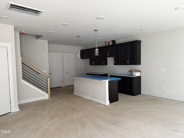 kitchen featuring decorative light fixtures and a kitchen island