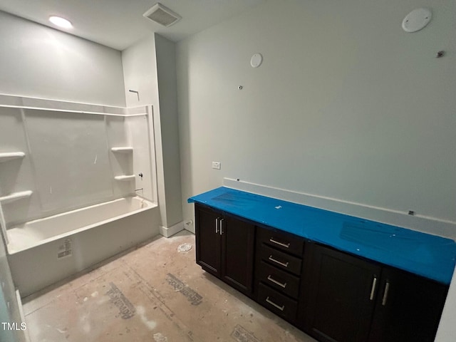 bathroom featuring shower / tub combination and vanity