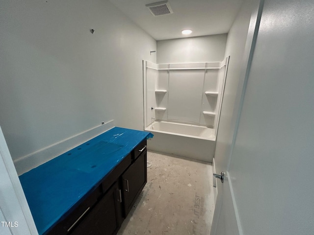 bathroom with vanity, bathtub / shower combination, and concrete floors