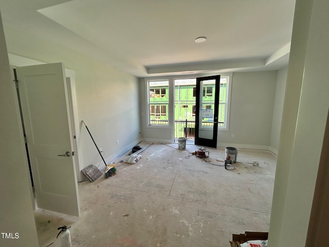 empty room featuring a tray ceiling