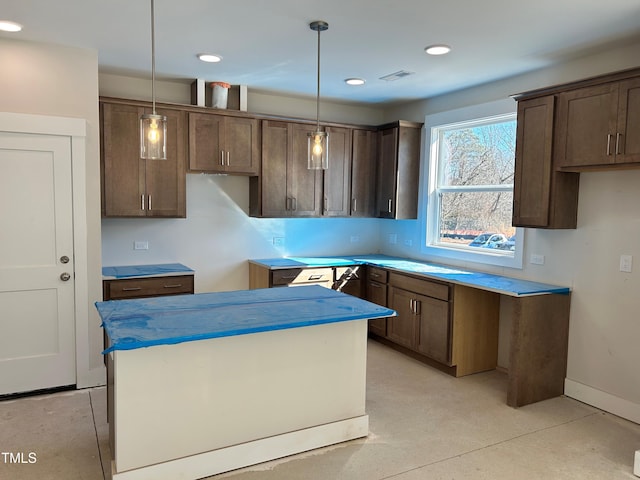 kitchen featuring hanging light fixtures and a kitchen island