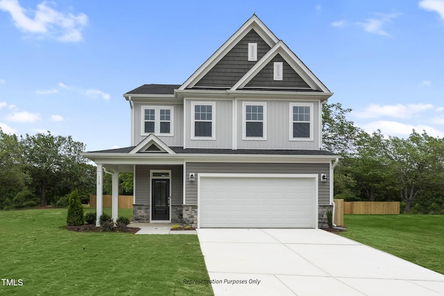 craftsman-style house featuring a front yard and a garage