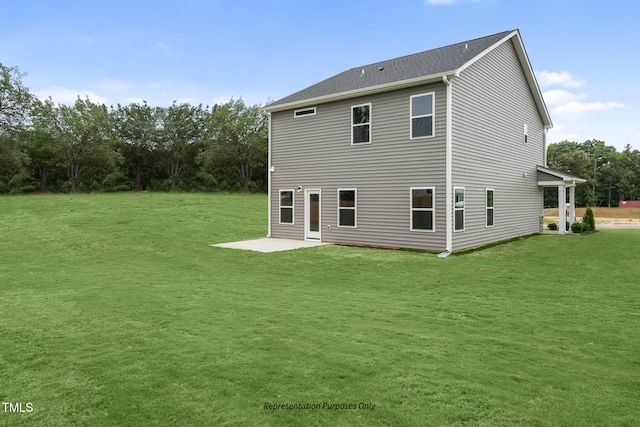 back of property featuring a yard and a patio