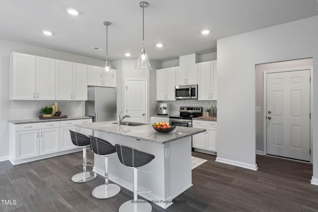 8816 Melvin St Unit 15-, Smithfield, Willow Springs, NC 27592 - kitchen with stainless steel appliances, a sink, dark wood-style flooring, backsplash, and recessed lighting