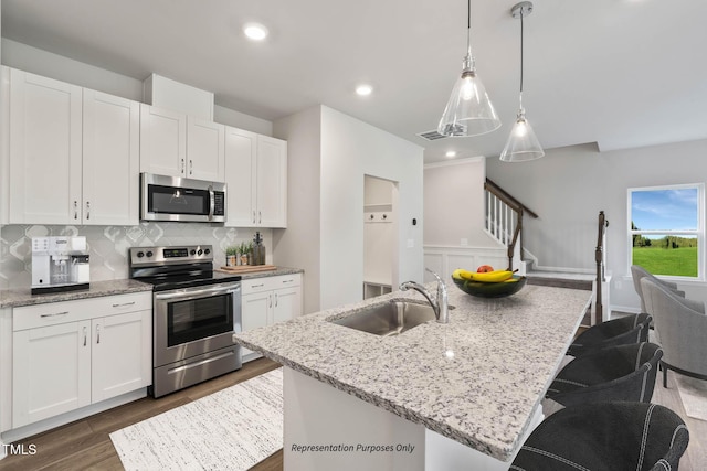 8816 Melvin St Unit 15-, Smithfield, Willow Springs, NC 27592 - kitchen with stainless steel appliances, a sink, dark wood-type flooring, white cabinets, and tasteful backsplash