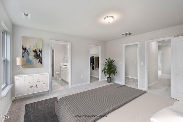 8816 Melvin St Unit 15-, Smithfield, Willow Springs, NC 27592 - unfurnished bedroom featuring light colored carpet, a spacious closet, ensuite bath, baseboards, and a closet