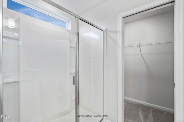 8816 Melvin St Unit 15-, Smithfield, Willow Springs, NC 27592 - bathroom with a stall shower, a walk in closet, and baseboards