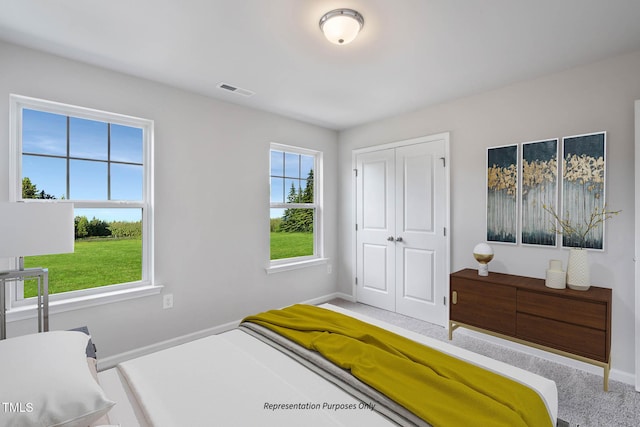 8816 Melvin St Unit 15-, Smithfield, Willow Springs, NC 27592 - carpeted bedroom featuring a closet and baseboards