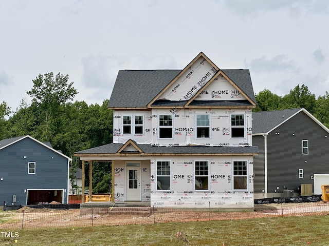 8816 Melvin St Unit 15-, Smithfield, Willow Springs, NC 27592 - property under construction featuring covered porch, a shingled roof, a fenced front yard, and central air condition unit