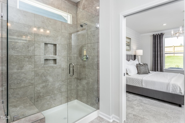 full bathroom with ornamental molding, a shower stall, and ensuite bath