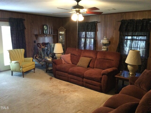 living room featuring carpet floors and a wealth of natural light