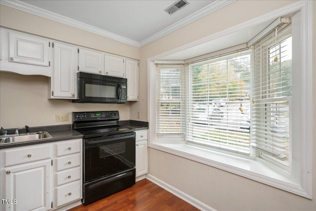 kitchen with crown molding, sink, dark wood-type flooring, black appliances, and white cabinets