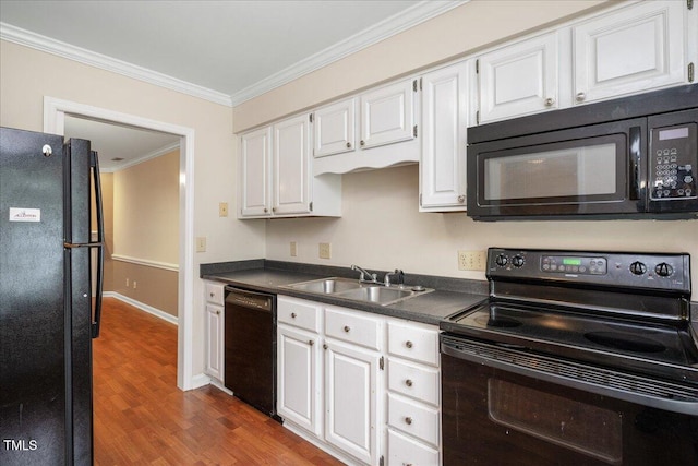 kitchen with white cabinetry, sink, crown molding, hardwood / wood-style floors, and black appliances