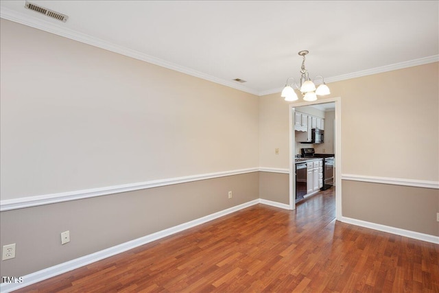 unfurnished dining area featuring a chandelier, ornamental molding, and dark wood-type flooring