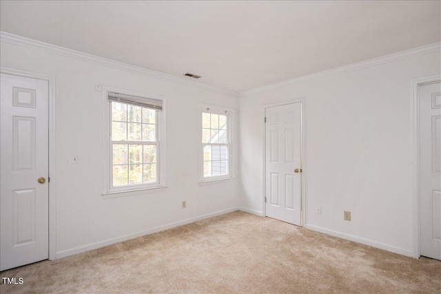 carpeted spare room with ornamental molding