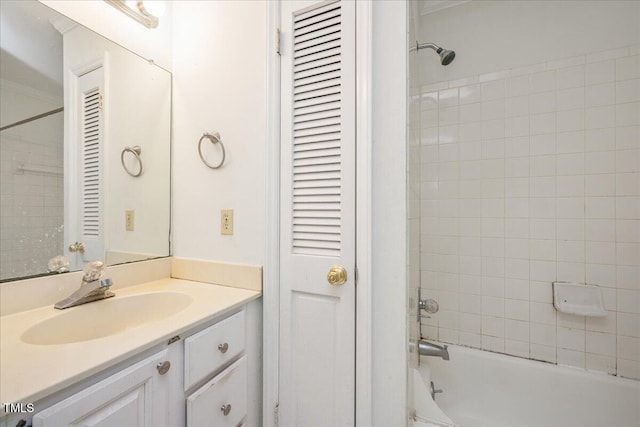 bathroom with vanity and tiled shower / bath combo