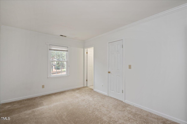 unfurnished room with light carpet and ornamental molding