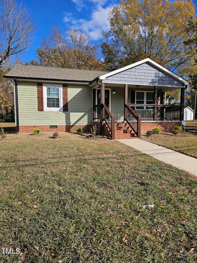 view of front of property with a porch and a front lawn