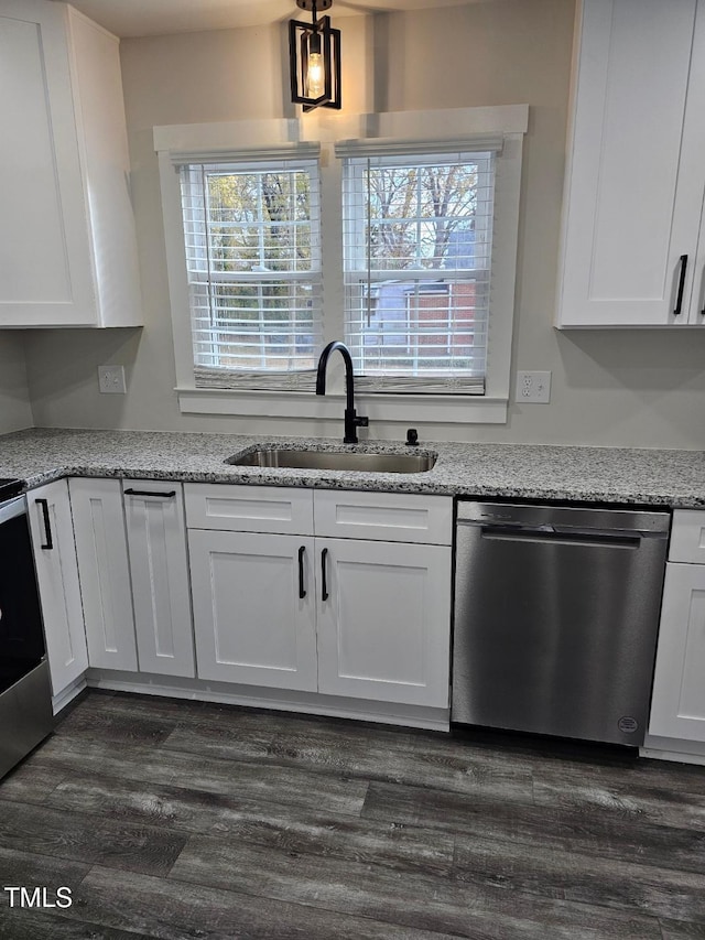 kitchen with light stone countertops, sink, stainless steel appliances, dark hardwood / wood-style flooring, and white cabinets