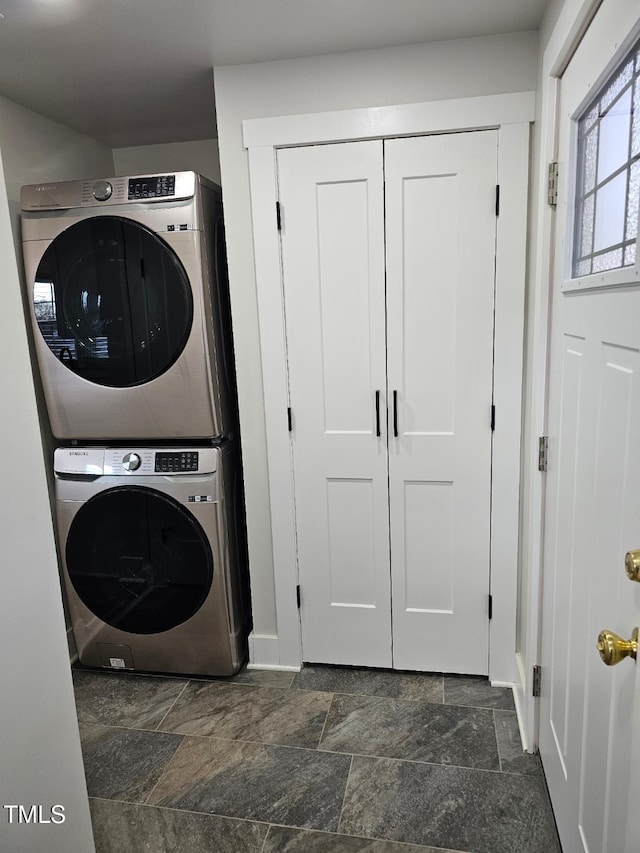 laundry room featuring stacked washer / dryer