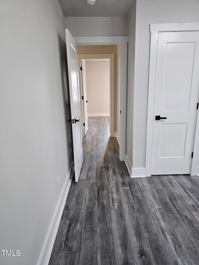 hall with dark wood-type flooring