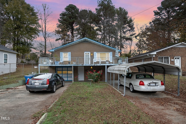 view of front facade featuring a garage and a carport