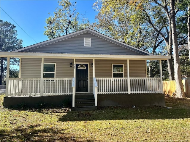 bungalow-style house featuring a front yard