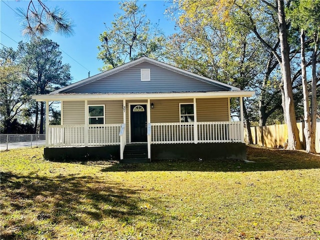 bungalow-style house with a front yard