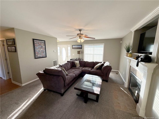 living room with carpet floors and ceiling fan